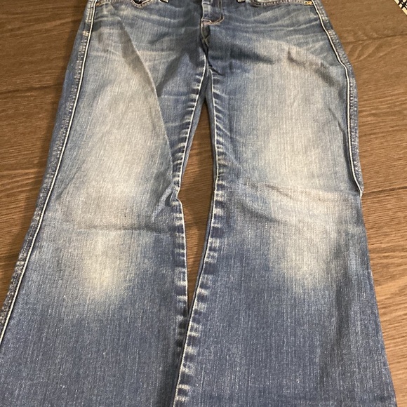 7 for all mankind boot cut flare jeans. Size 27. Medium wash. Faded front. - Picture 9 of 16